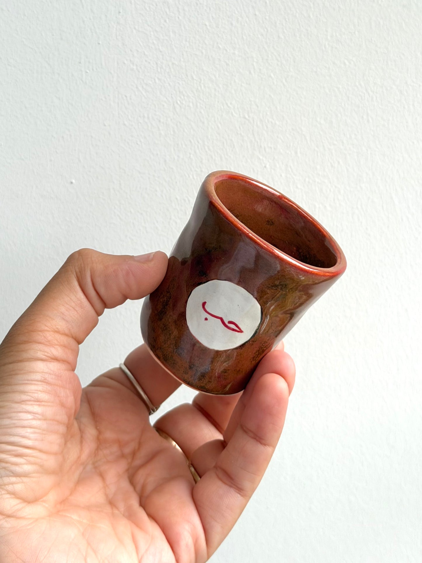 Espresso cup glaze test (Arabic word for love) 6